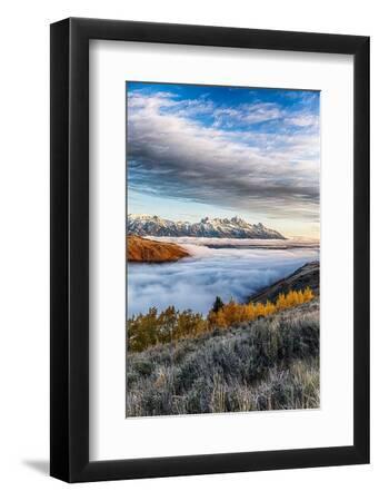 Layer of fog in the valley below the peaks of Grand Teton National Park. - Black Framed Art Print Wall Art, 8x12
